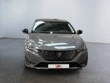 the front view of a grey car parked in a showroom