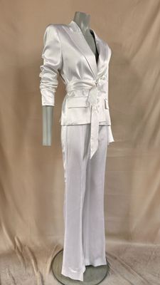 an image of a white suit on a mannequin stand