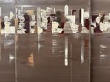 three paintings of brown and white paint on a wooden surface