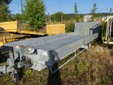 an image of a flatbed trailer parked in a field