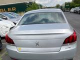 a silver car parked on the side of the road