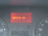 the dashboard of a car with the time displayed on the display