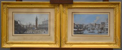 two framed paintings of a view of a city with a clock tower