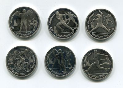 six different types of coins are shown on a white surface
