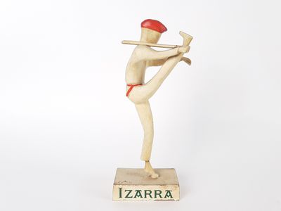 wooden figurine of a baseball player holding a bat on a base