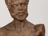 statue of a man with a beard and no shirt on