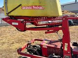 an image of a red tractor with a yellow container on it ' s back