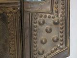 a metal cabinet with a glass jar on top of it