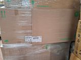 a large stack of boxes sitting on a pallet in a warehouse