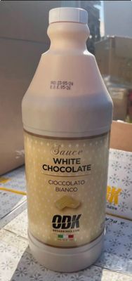 a bottle of white chocolate sitting on a table