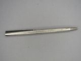 an image of a pen on a white surface