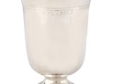 a silver cup on a pedestal on a white background