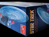 a cardboard box with a model of a star trek ship on it