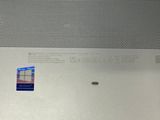 a picture of a laptop with a sticker on it