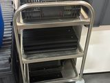 a cart that has a bunch of books on top of it