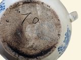 a cup of coffee with a smiley face drawn on it