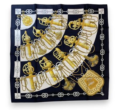 a black and white scarf with gold and silver decorations
