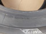 a close up of a tire on the side of the road