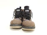 a pair of brown boots with black laces on them