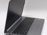 a laptop that is open on a white surface