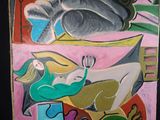 un tableau représentant une femme et un chat posés sur une table