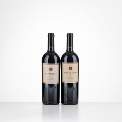 two bottles of red wine sitting on top of a table