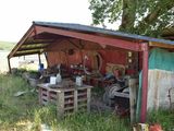 a shed that has a lot of junk in it