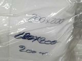 a bag of toilet paper that is wrapped in plastic