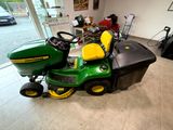 a lawn mower sitting in the middle of a room