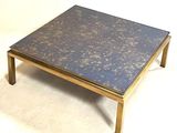 a coffee table with a blue marble top on a white background