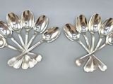 two silver spoons and spoon spoons on a gray surface