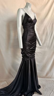 an image of a mannequin wearing a black dress on a mannequin mannequin