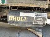 a truck with a sign that says dhol on it