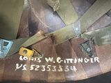 a close up of a military helmet with a tag on it