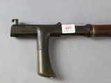 a very old gun that is on a table