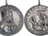 a close up of a coin with a woman on it