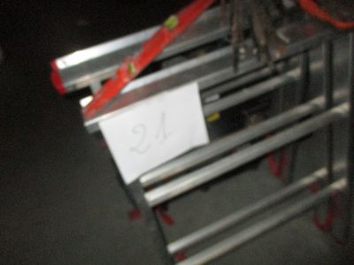 a picture of a metal shelf with a sign on it