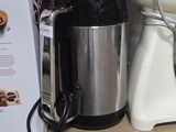 a picture of a coffee maker on a shelf in a store