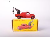 a red toy truck with a crane on top of it