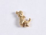a close up of a small dog charm on a white surface