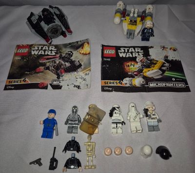 lego star wars minifigurs sit on a bed with a magazine