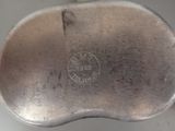 an image of a metal object with a logo on it