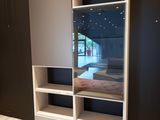 a picture of a bedroom with a bed and a closet