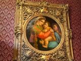 a picture of a painting on the wall of a room