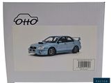the box is open to show a picture of a blue car