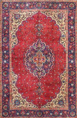 a red rug with a medallion design on it