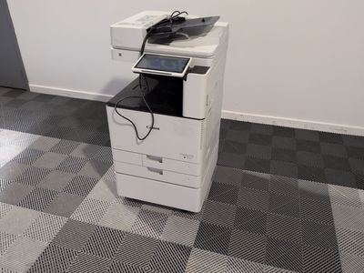 a white printer sitting on top of a black and white printer