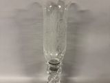 a clear glass vase sitting on top of a table