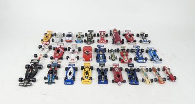 a lot of toy cars that are sitting on a table
