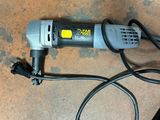 an image of a corded electric tool on the floor